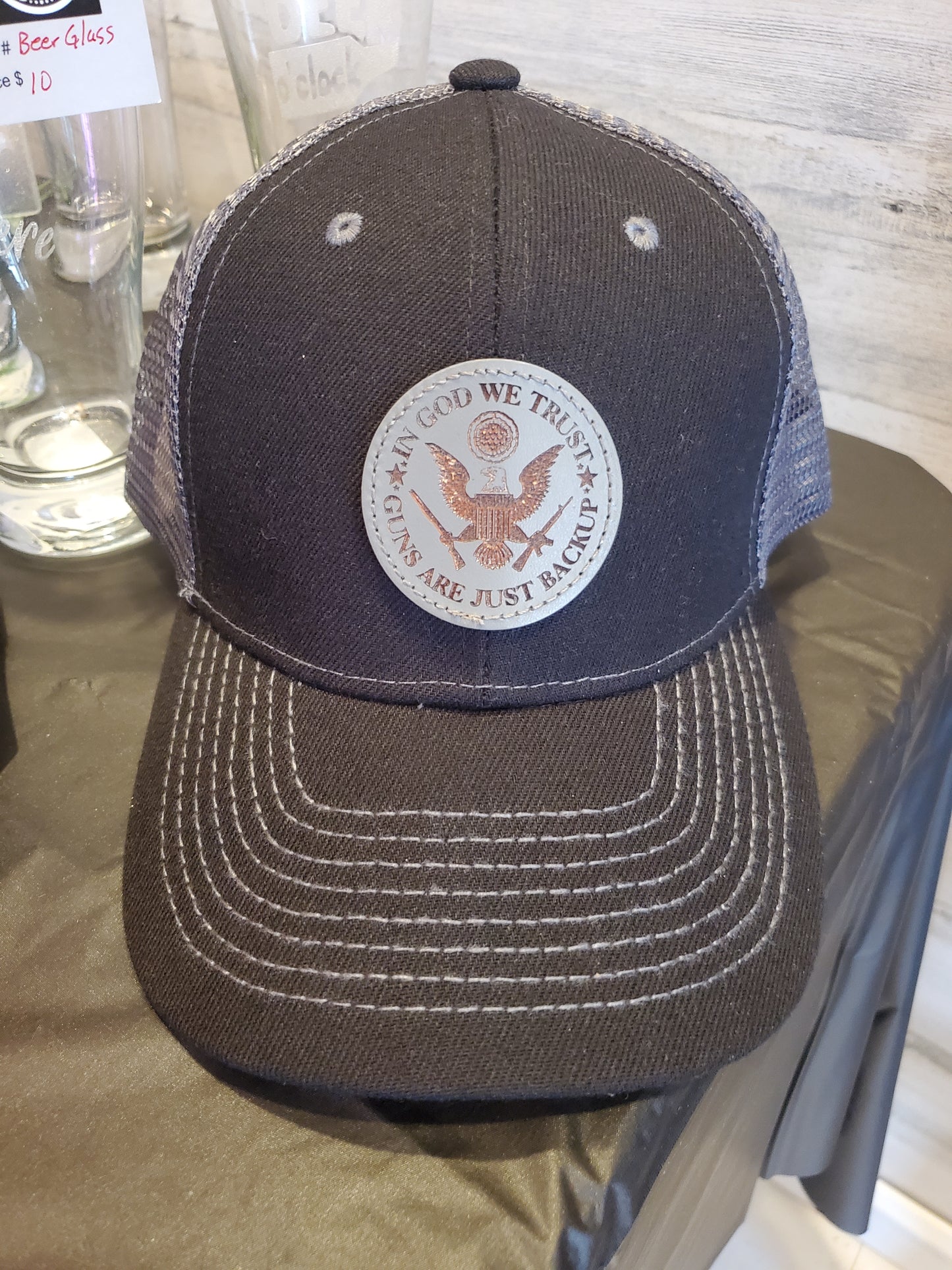 Black Trucker Hat with Laser Engraved Gray Round Leather Patch