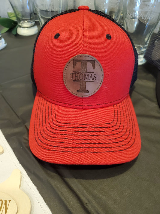Red Trucker Hat with Laser Engraved Round Mocha Leather Patch