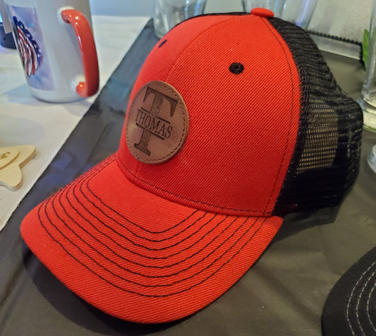 Red Trucker Hat with Laser Engraved Round Mocha Leather Patch